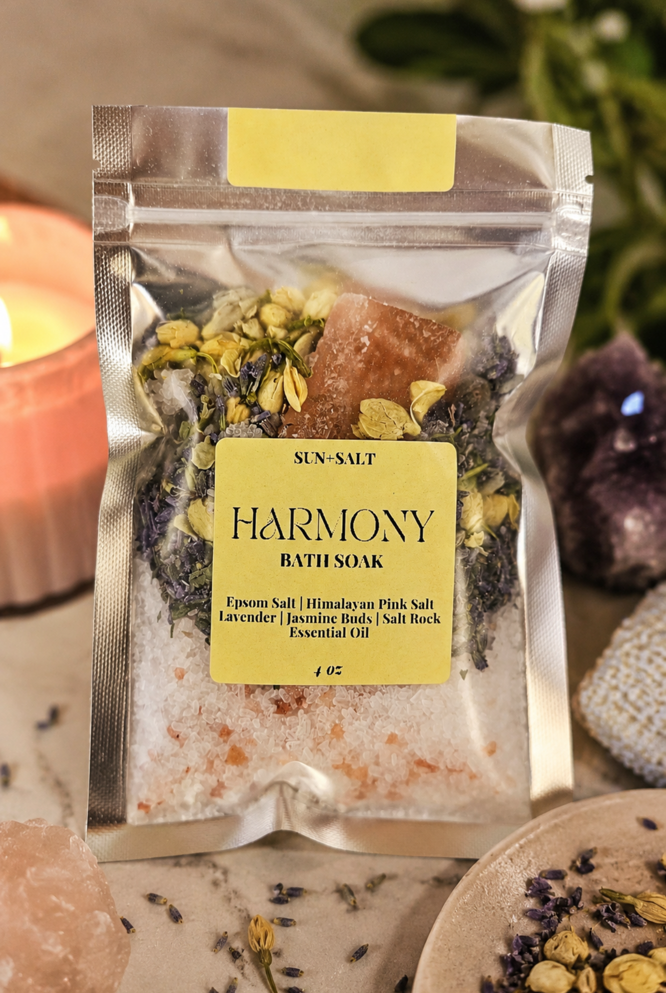 Harmony bath soak package with a candle and crystals in the background